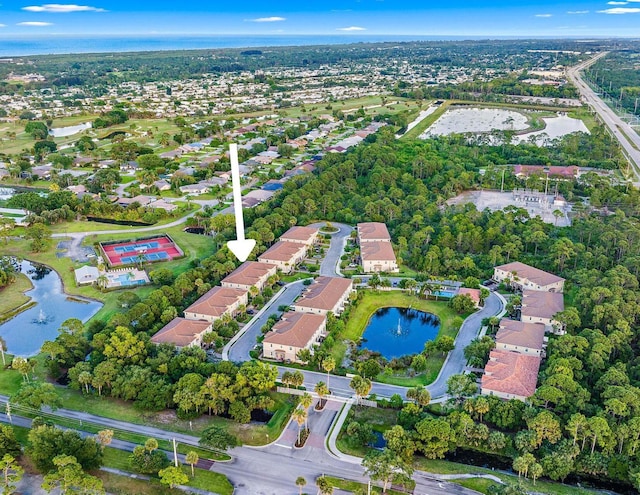 bird's eye view with a residential view and a water view