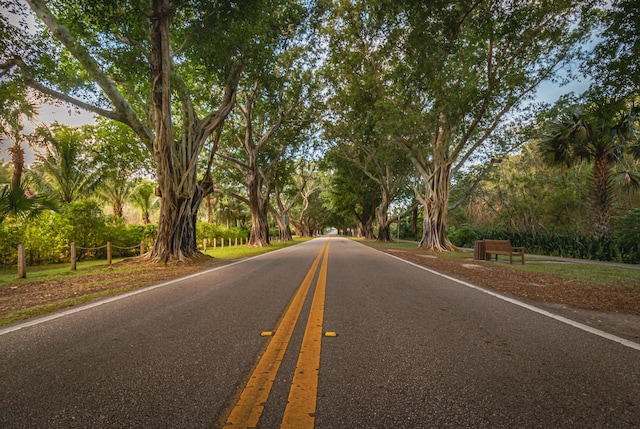 6232 SE Portofino Cir Unit 903, Hobe Sound, FL 33455 - view of asphalt road featuring view of scattered trees