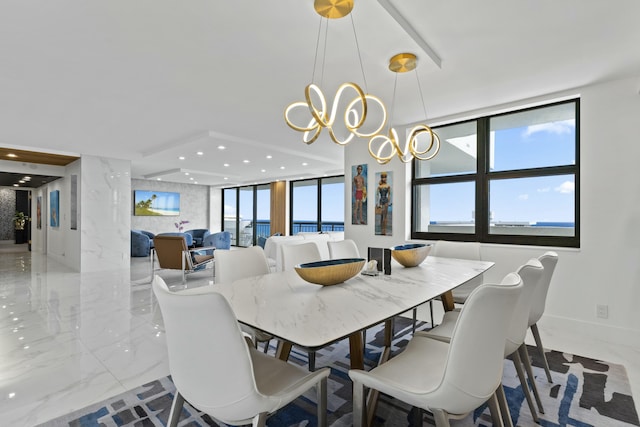 dining space featuring recessed lighting, marble finish floor, and a chandelier