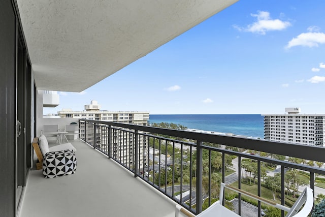 balcony featuring a water view