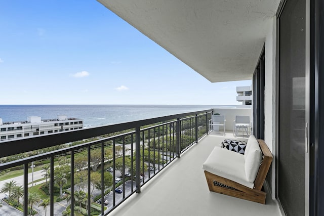 balcony featuring a water view