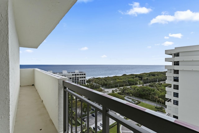 balcony featuring a water view