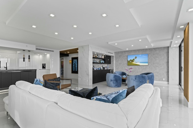 living area with recessed lighting, stone wall, indoor bar, and marble finish floor