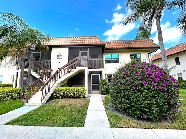 view of property featuring stairs