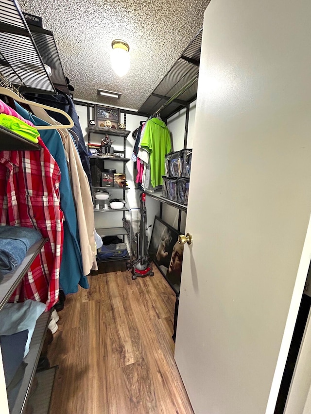 spacious closet featuring wood finished floors