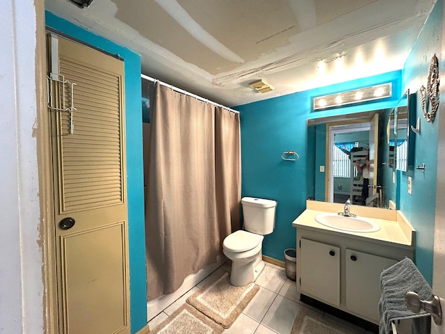 full bath featuring vanity, toilet, a shower with curtain, and tile patterned flooring