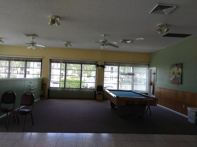 game room featuring a wainscoted wall, visible vents, and ceiling fan