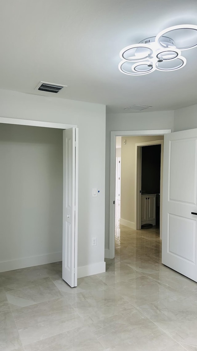 840 Clow St E, Lehigh Acres, FL 33974 - unfurnished room with visible vents, baseboards, and marble finish floor