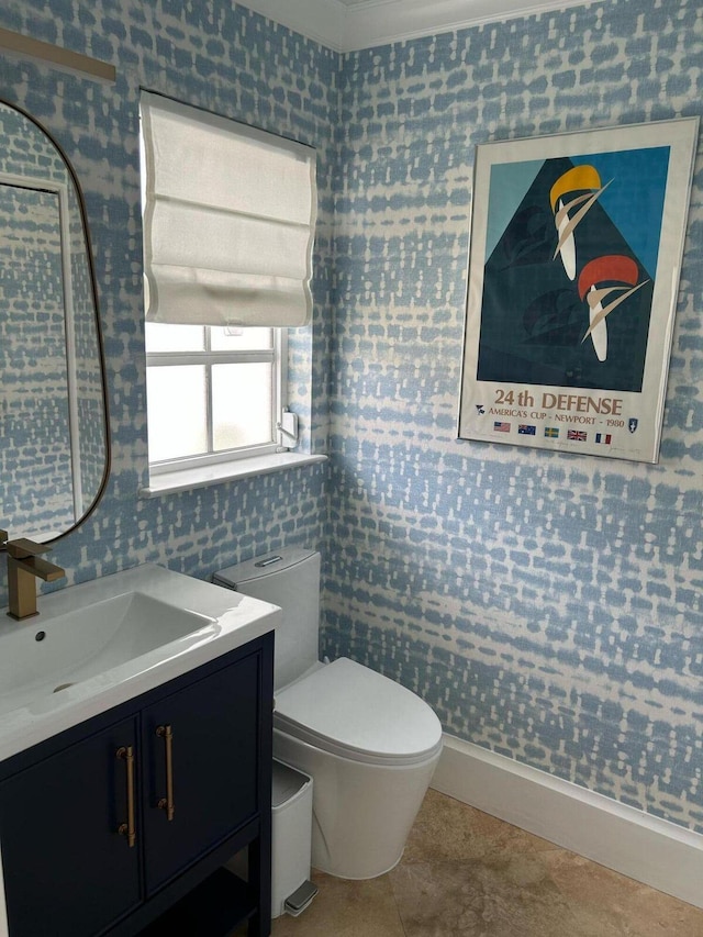 609 NE 19th Ave, Deerfield Beach, FL 33441 - bathroom featuring tile patterned flooring, toilet, and vanity