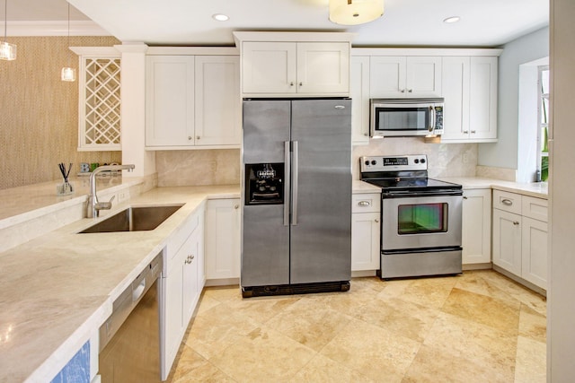 609 NE 19th Ave, Deerfield Beach, FL 33441 - kitchen featuring tasteful backsplash, pendant lighting, recessed lighting, appliances with stainless steel finishes, and a sink