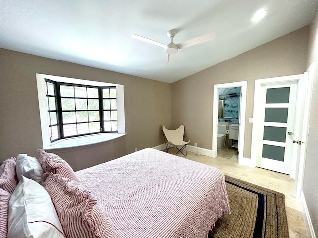 609 NE 19th Ave, Deerfield Beach, FL 33441 - bedroom featuring baseboards, ensuite bath, a ceiling fan, and vaulted ceiling