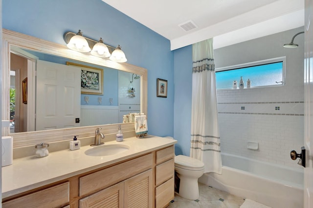 full bath featuring tile patterned floors, visible vents, shower / bath combo with shower curtain, toilet, and vanity