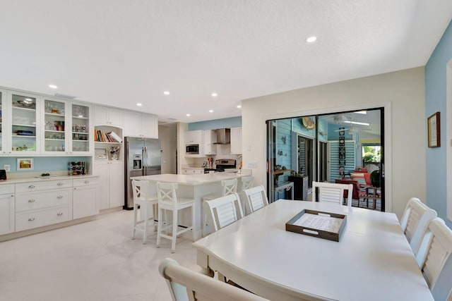 dining room featuring recessed lighting