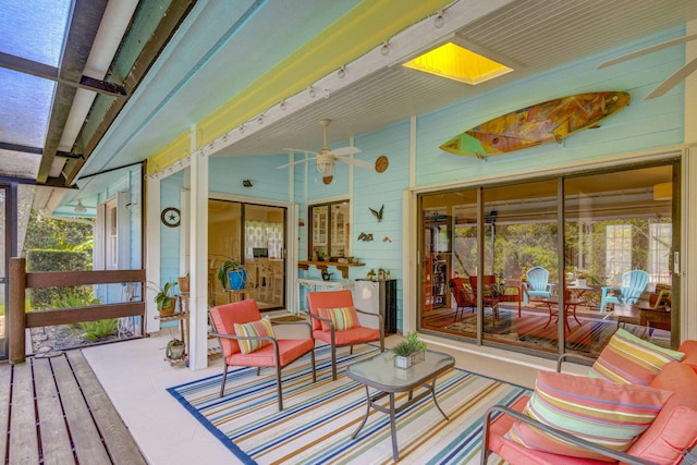 wooden terrace with a ceiling fan