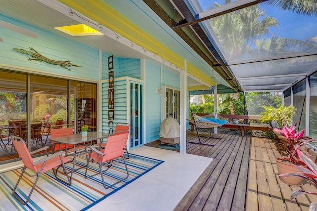 deck featuring french doors and outdoor dining area