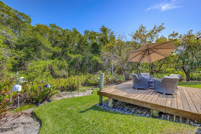 view of yard featuring an outdoor living space and a wooden deck