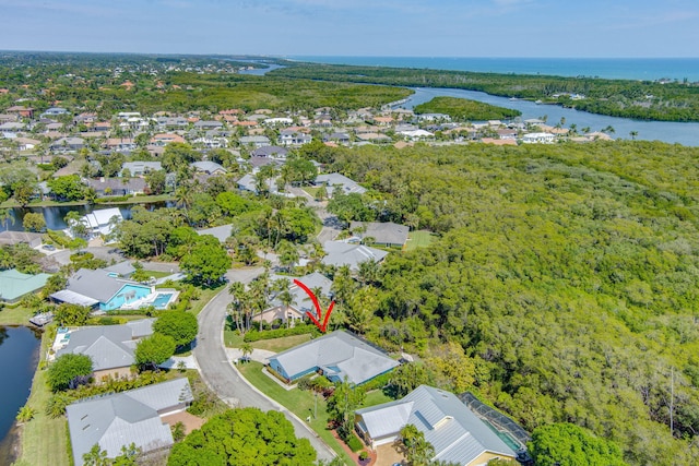 aerial view with a residential view and a water view