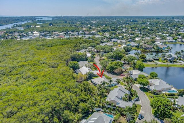 bird's eye view with a residential view and a water view