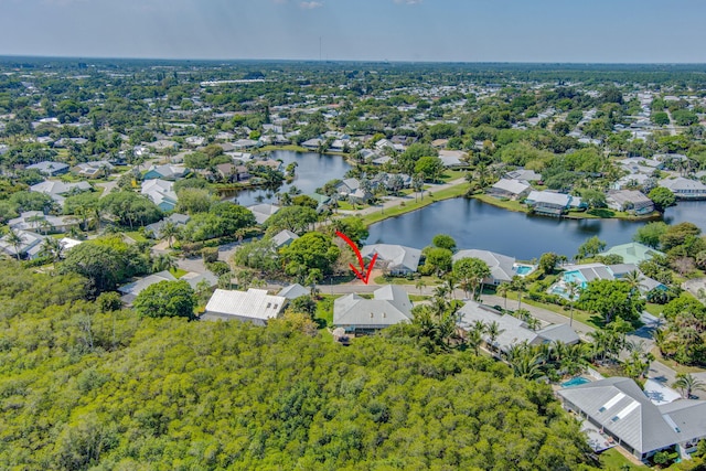 birds eye view of property featuring a residential view and a water view