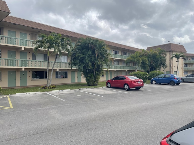400 Village Green Cir W Unit 202, Palm Springs, FL 33461 - view of property with uncovered parking