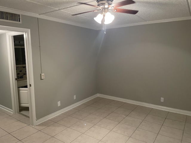 400 Village Green Cir W Unit 202, Palm Springs, FL 33461 - spare room with ceiling fan, ornamental molding, light tile patterned flooring, baseboards, and a textured ceiling