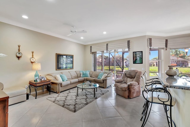 living area with light tile patterned floors, recessed lighting, ornamental molding, and a ceiling fan