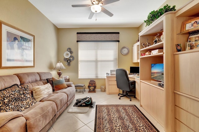 office area featuring light tile patterned flooring, baseboards, and ceiling fan