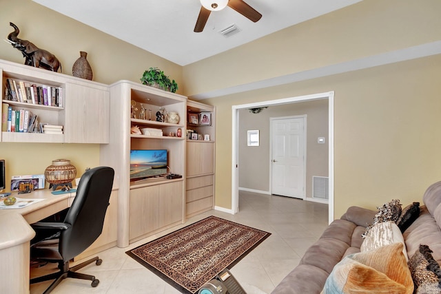 office featuring light tile patterned floors, visible vents, and a ceiling fan