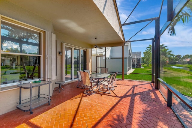 sunroom with a ceiling fan