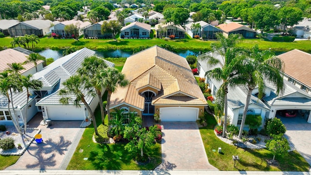 birds eye view of property with a residential view