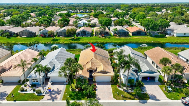 aerial view with a residential view and a water view