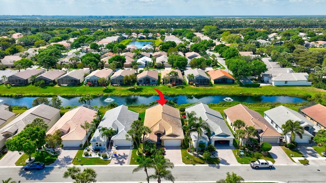 bird's eye view featuring a residential view and a water view