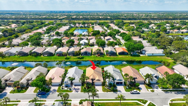 aerial view with a residential view and a water view