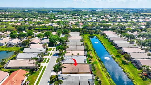 bird's eye view with a residential view and a water view