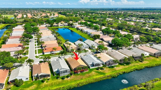 bird's eye view featuring a residential view and a water view