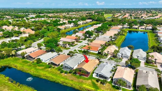 birds eye view of property featuring a residential view and a water view