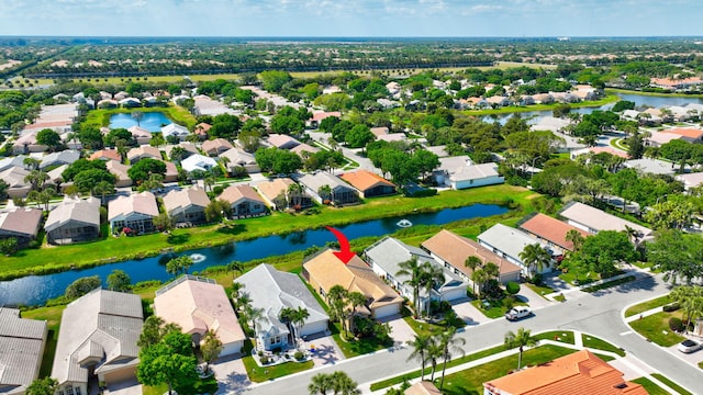 aerial view featuring a residential view and a water view