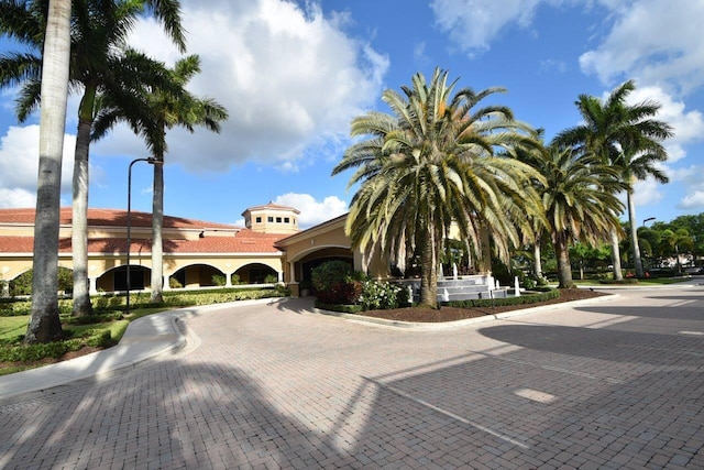 view of property with decorative driveway