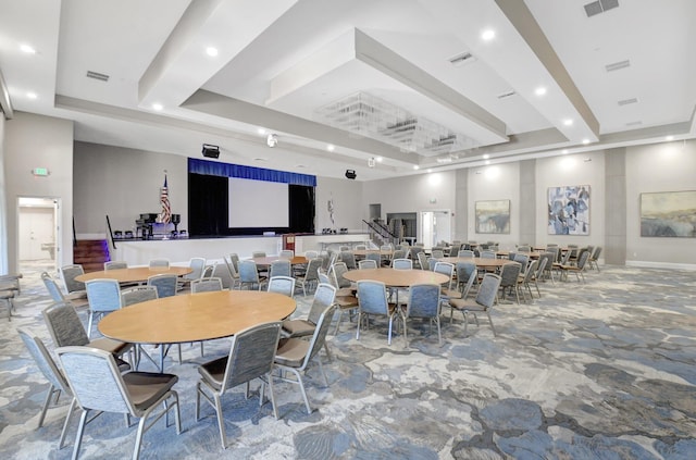 dining room featuring recessed lighting, a tray ceiling, and visible vents