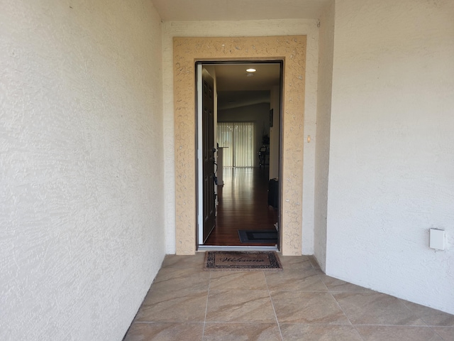 property entrance featuring stucco siding