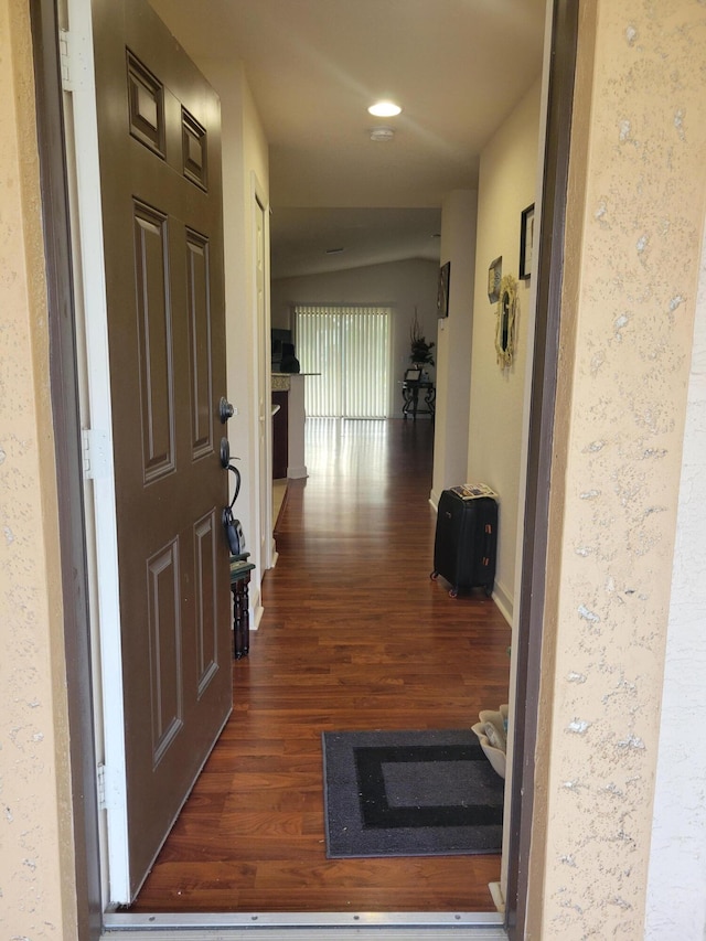 hall with recessed lighting, baseboards, and dark wood-style flooring