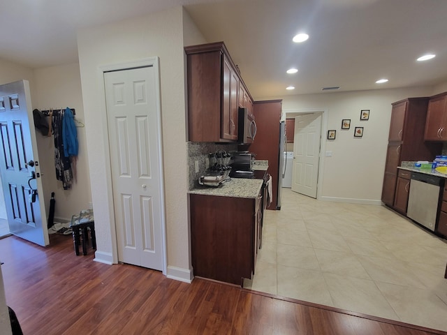kitchen featuring recessed lighting, appliances with stainless steel finishes, and light wood-type flooring