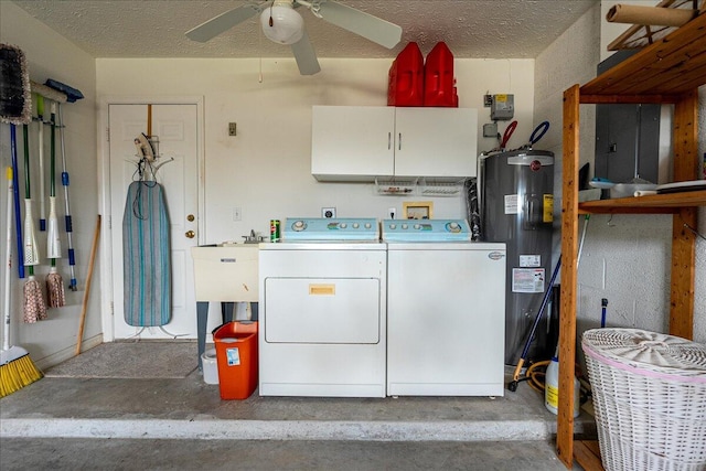 clothes washing area featuring a ceiling fan, washer and dryer, a textured ceiling, water heater, and cabinet space