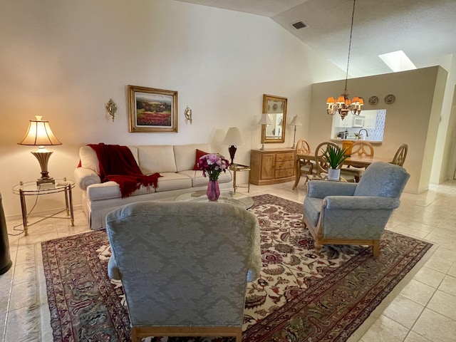 living room with tile patterned floors, visible vents, high vaulted ceiling, a skylight, and a chandelier