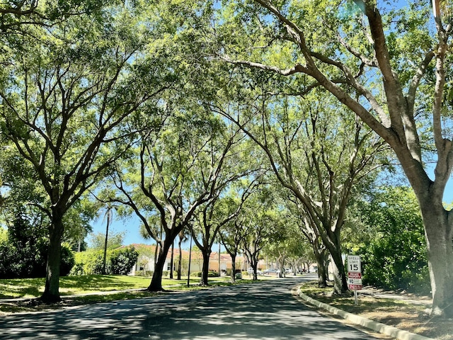 view of road with curbs and sidewalks