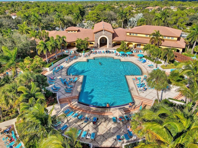 community pool with a patio area