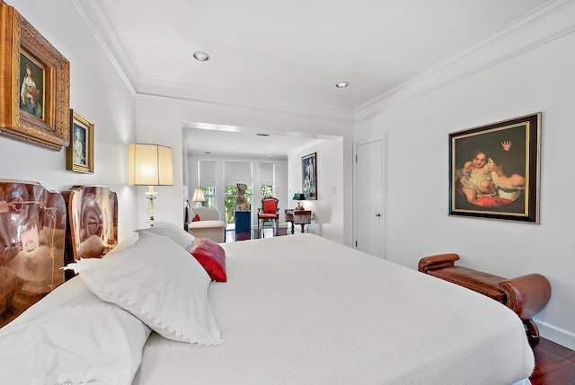 bedroom featuring recessed lighting, crown molding, baseboards, and wood finished floors