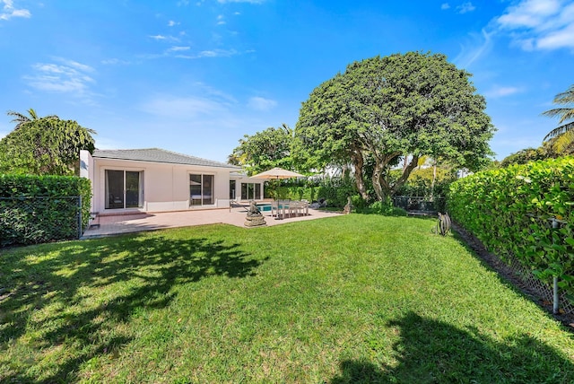 view of yard with a patio and a fenced backyard