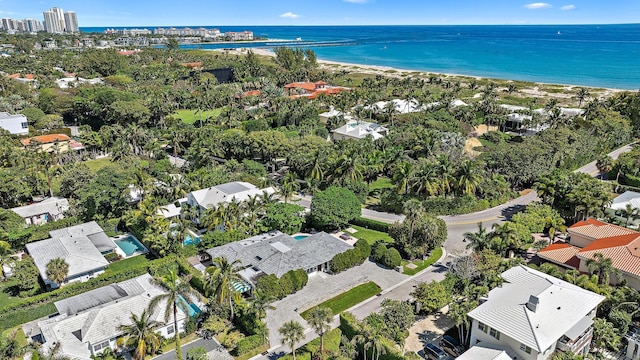 birds eye view of property featuring a view of the beach and a water view