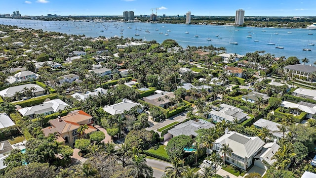 birds eye view of property with a residential view and a water view